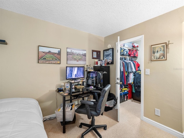 office area featuring carpet and a textured ceiling