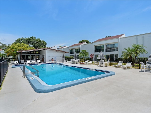 view of swimming pool with a patio