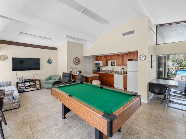 game room with sink, pool table, light tile floors, and beam ceiling