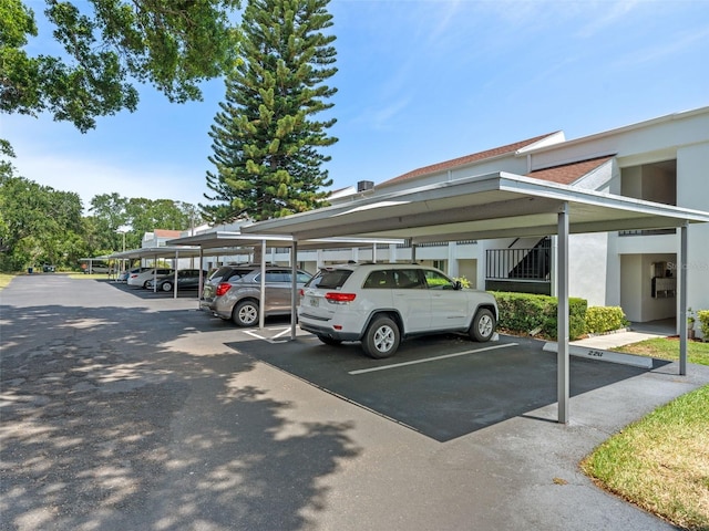 view of vehicle parking with a carport