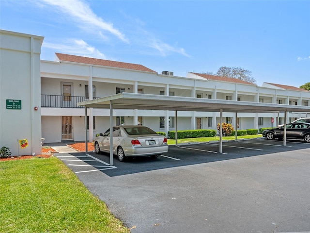 view of vehicle parking featuring a carport