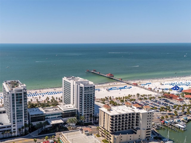 birds eye view of property with a beach view and a water view