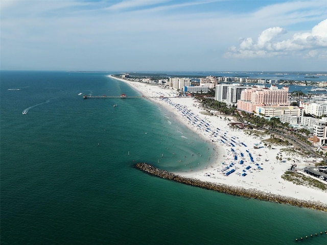 bird's eye view featuring a water view and a view of the beach