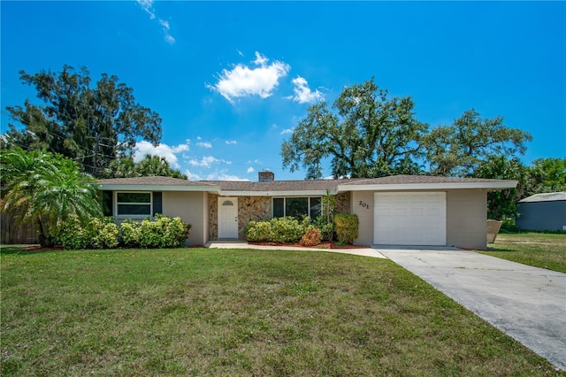 ranch-style house featuring a front lawn and a garage