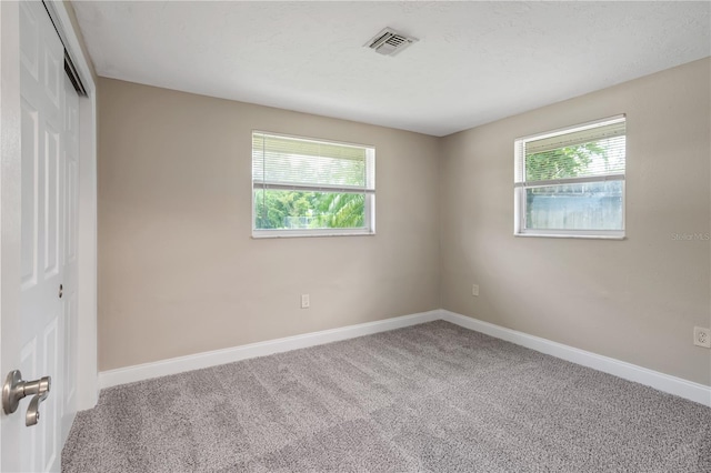 spare room with carpet