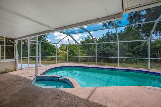 view of swimming pool with a patio and glass enclosure