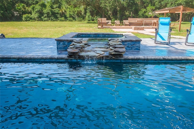 view of swimming pool featuring a lawn