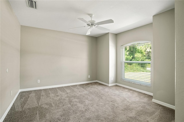 carpeted empty room with ceiling fan