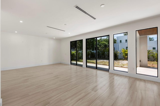 unfurnished room featuring light hardwood / wood-style floors