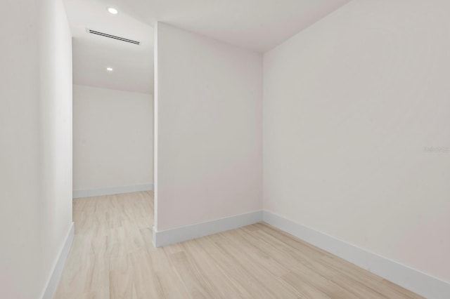 spare room featuring light hardwood / wood-style flooring