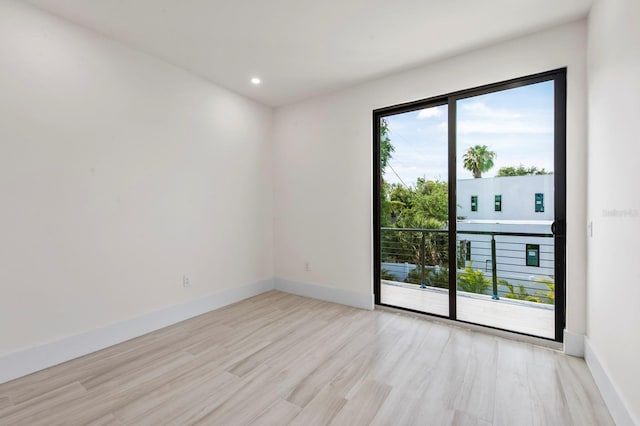 unfurnished room featuring light hardwood / wood-style floors