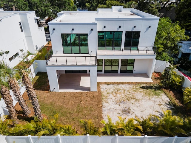 exterior space featuring a balcony and a patio area