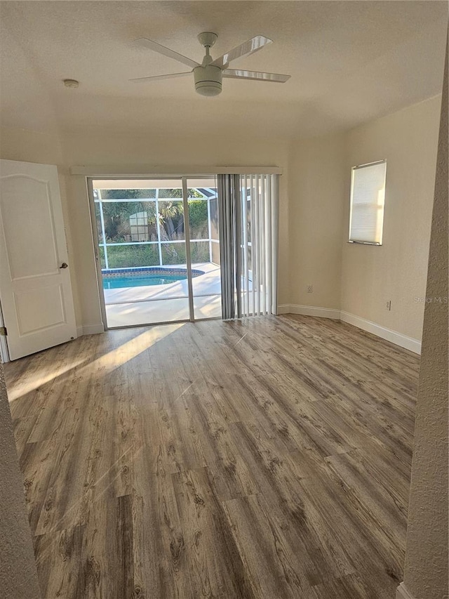 spare room featuring ceiling fan and wood-type flooring