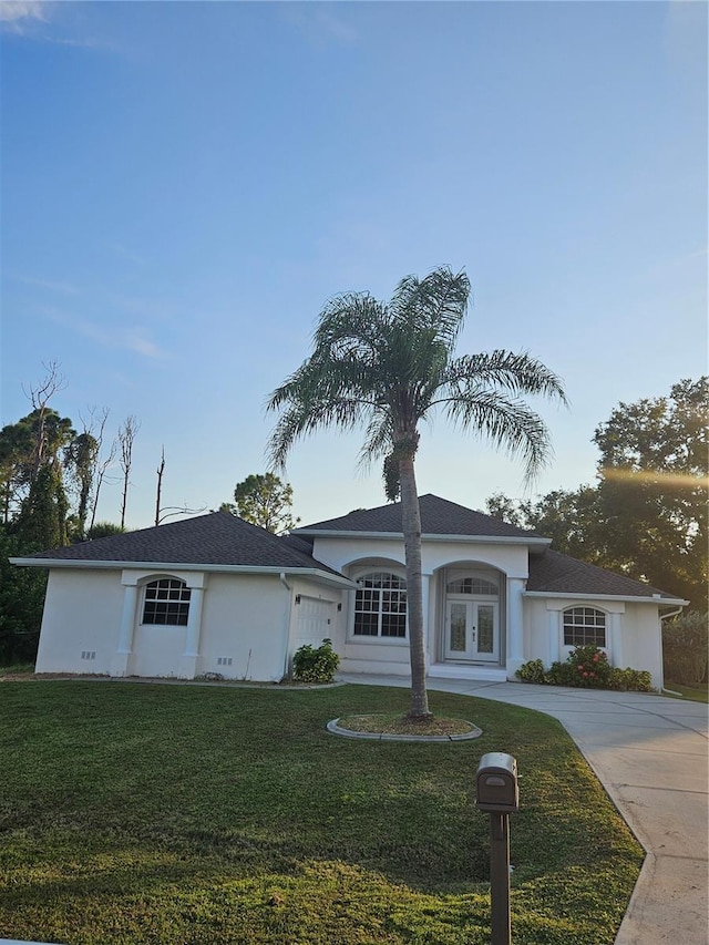 ranch-style house with a front lawn