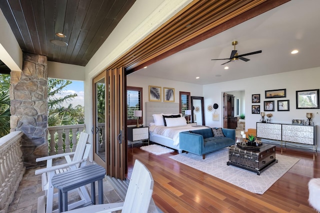 living room featuring wood-type flooring and ceiling fan