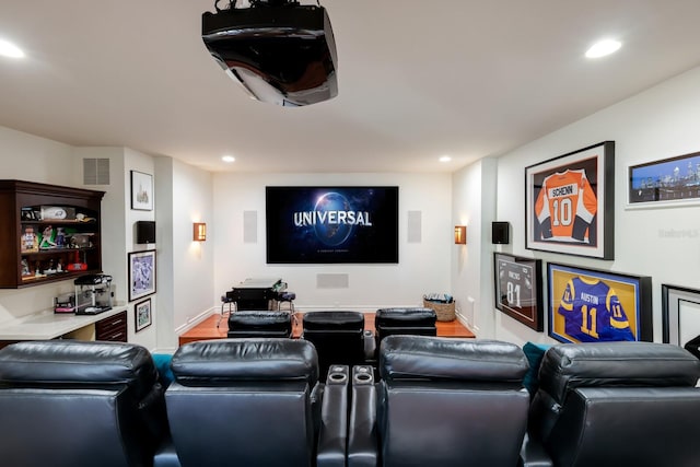 home theater room featuring wood-type flooring