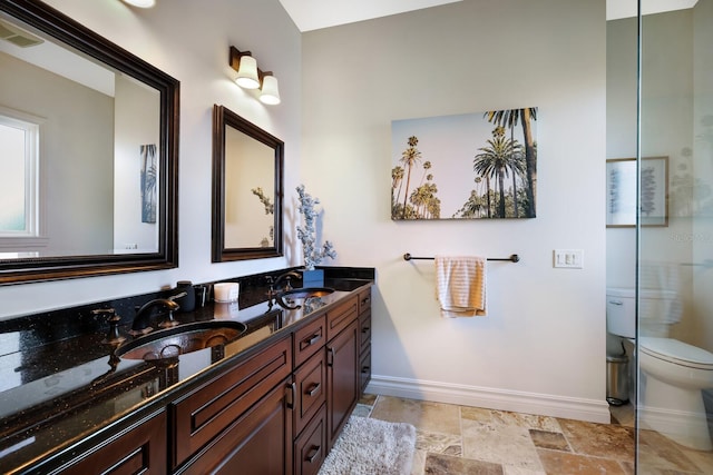 bathroom featuring dual sinks, toilet, tile floors, and large vanity