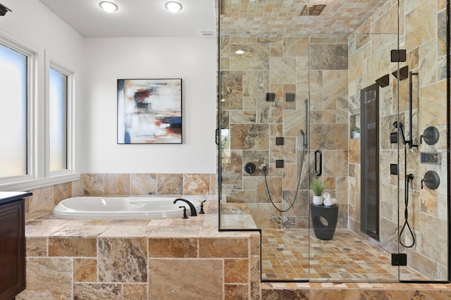 bathroom featuring vanity and shower with separate bathtub