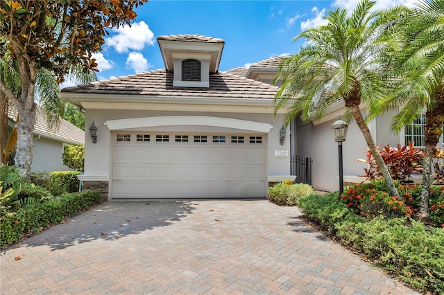 view of front of property with a garage