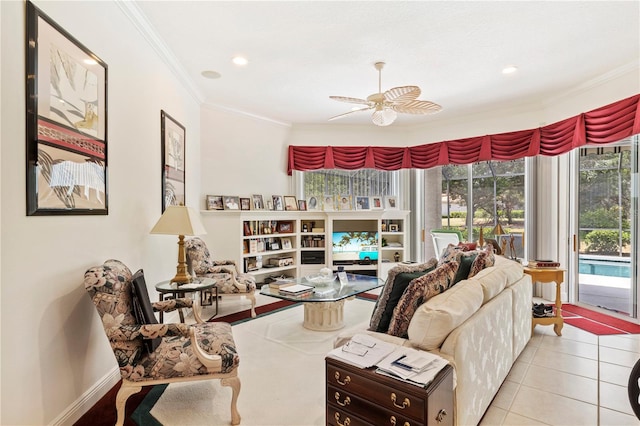 tiled living room with ceiling fan and ornamental molding