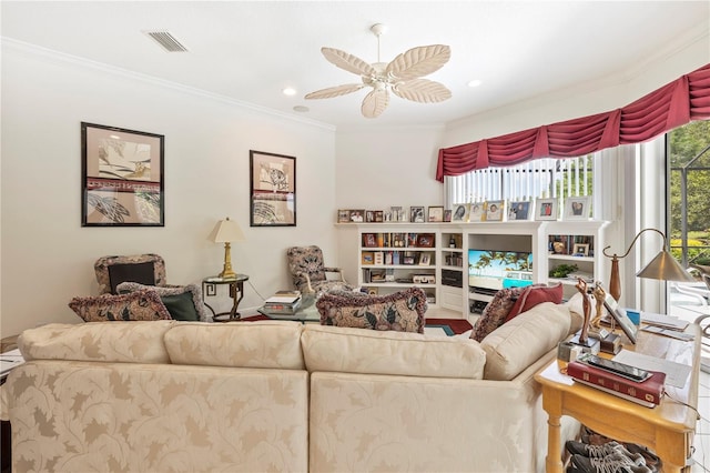 living room featuring ceiling fan and ornamental molding