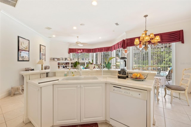 kitchen featuring plenty of natural light, sink, dishwasher, and light tile floors