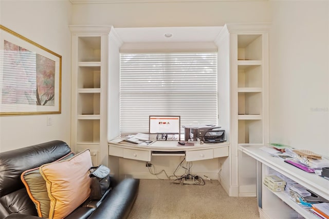 home office featuring built in shelves and carpet flooring