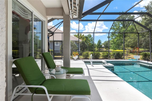 view of swimming pool with a patio and glass enclosure