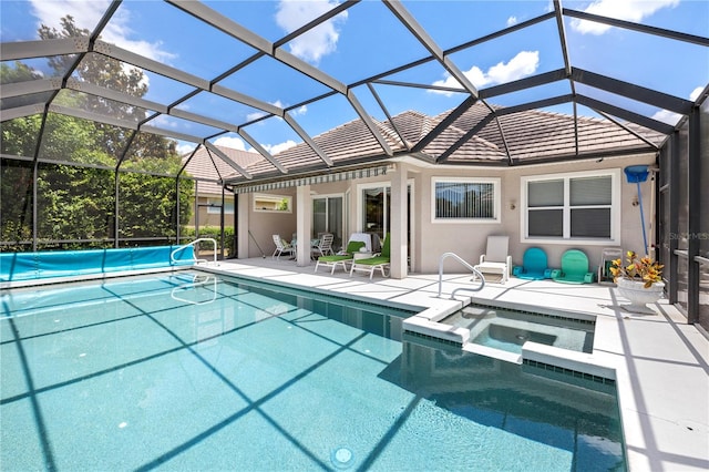 view of swimming pool featuring a patio area, an in ground hot tub, and glass enclosure