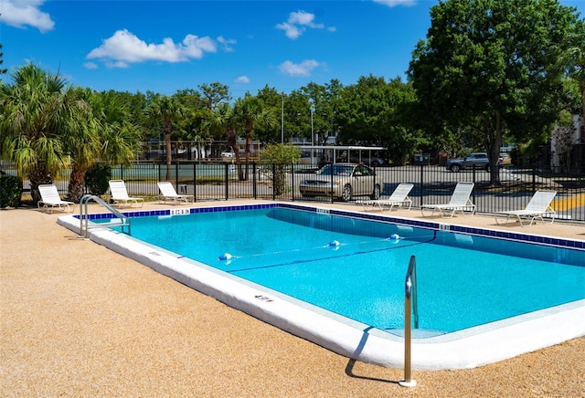 view of swimming pool with a patio