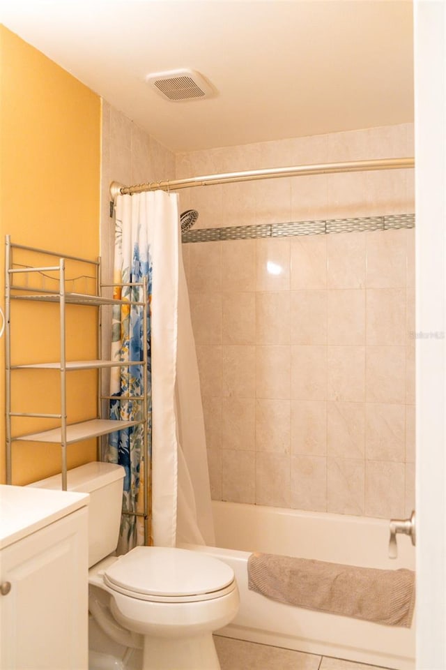 full bathroom featuring tile patterned flooring, vanity, shower / bath combination with curtain, and toilet