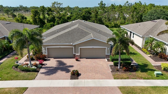 view of front facade with a garage and a front yard