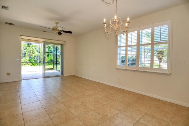 spare room with light tile floors and ceiling fan with notable chandelier