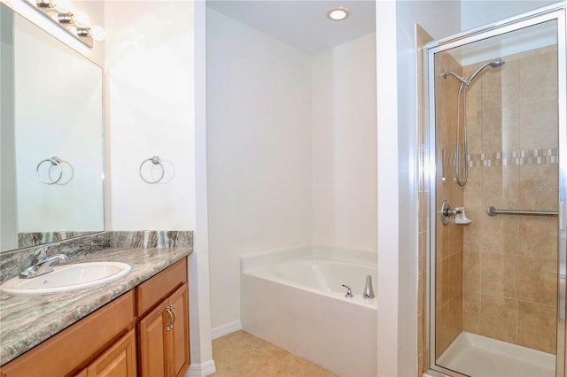 bathroom featuring tile floors, separate shower and tub, and oversized vanity