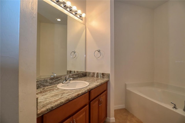 bathroom with tile flooring, a washtub, and oversized vanity