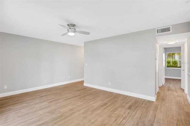 unfurnished room featuring ceiling fan and light hardwood / wood-style floors