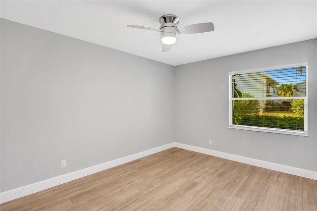 spare room featuring ceiling fan and light hardwood / wood-style floors