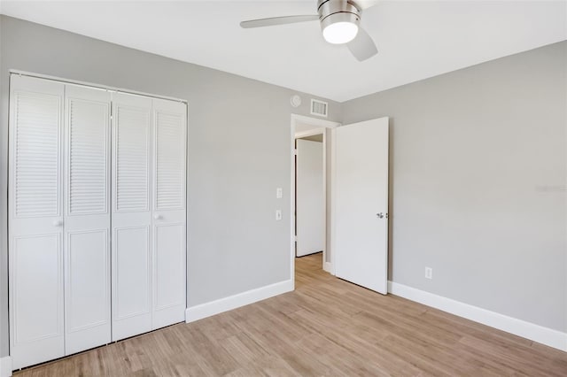 unfurnished bedroom with a closet, ceiling fan, and light hardwood / wood-style floors