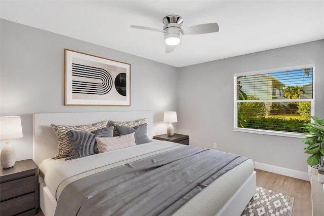 bedroom featuring light hardwood / wood-style flooring and ceiling fan