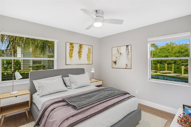 bedroom featuring light hardwood / wood-style flooring and ceiling fan