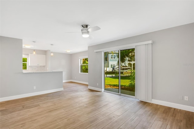 unfurnished room with ceiling fan