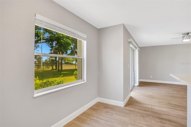 unfurnished room with a wealth of natural light and light hardwood / wood-style flooring