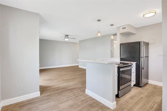 kitchen featuring electric range, light hardwood / wood-style flooring, hanging light fixtures, and ceiling fan