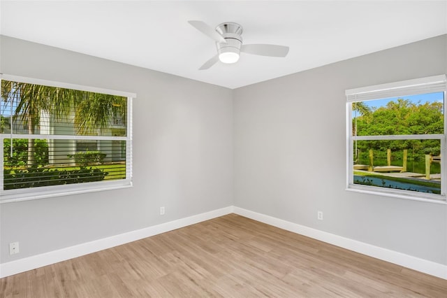 spare room featuring ceiling fan and light wood-type flooring