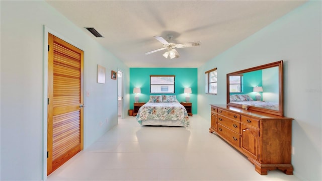 bedroom featuring ceiling fan and a closet