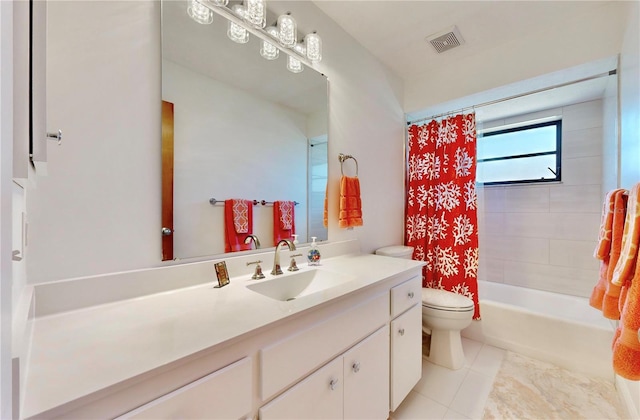 full bathroom featuring tile patterned floors, vanity, shower / bath combination with curtain, and toilet