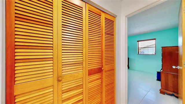 hallway featuring light tile patterned flooring