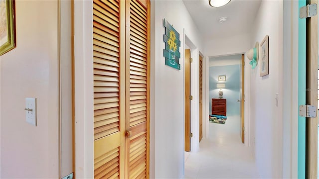 corridor featuring light tile patterned flooring