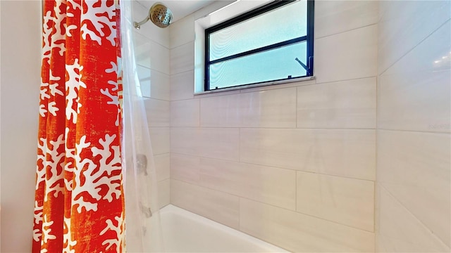 bathroom with shower / tub combo with curtain