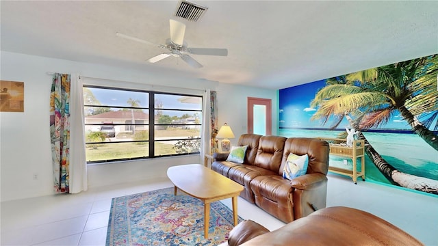 living room featuring light tile patterned floors and ceiling fan